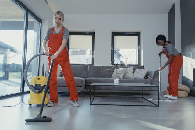 Cleaners wiping a floor
